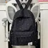 Mochila fresca y sencilla de lunares con lazo para mujer, nuevo modelo 2026, mochila versátil de gran capacidad para estudiantes de secundaria y preparatoria