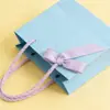 Ventas Directas de Fábrica Bolsas de Tote de Papel Kraft Grueso Bolsas de Compras para Ropa Regalo Bolsas de Papel de Empaque Rosa Al por Mayor
