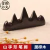 Estante de madera de catalpa negro al por mayor Wuzhishan estante para bolígrafos de madera colgador de pinceles para estudiantes pequeña montaña de bolígrafos estudio cuatro tesoros estante para bolígrafos de caoba