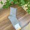 Calcetines de Algodón para Mujer de Primavera Temprana Color Sólido con Volantes de Longitud Media Importados de Dongdaemun Kikiya Corea Venta al por Mayor