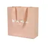 Bolsa de Empaque Yisheng Bolsa de Papel Bolsa de Regalo Personalizada con Logo Impreso Bolsa de Compras de Papel Rosa con Asa de Cinta