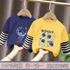 Camiseta de manga larga de algodón puro para niño, nuevo modelo primavera y otoño 2026, camiseta básica con estampado de dibujos animados para niño, top falso de dos piezas, moderno