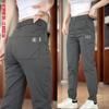 Pantalones de hombre otoño e invierno resistentes al desgaste peto de alta elasticidad pantalones rectos de hombre 2024 nuevos pantalones casuales ajustados para hombre