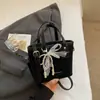 Bolso de Cubo Casual de Moda y Texturizado Nuevo Verano 2025 Elegante Simple de Nicho para Mujer Bolso de Hombro Cruzado