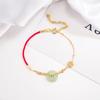 Pulsera de cuerda roja con hebilla de jade Benmingnian 2022, pulsera de jade con incrustaciones de dinero, lujo ligero, estilo retro de alta gama.