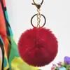 Al por mayor en stock Bola de pelo de imitación de conejo Rex de 8 cm llavero colgante lindo para mujer bolso de coche teléfono móvil colgante de felpa