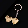 Llavero de metal con forma de corazón y diseño de plantas transfronterizo, espejo con acabado espejo para bricolaje, puede contener fotos, llavero de acero inoxidable