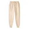 18 colores pantalones casuales para hombre color liso pantalones largos juveniles modernos tiro medio pantalones deportivos pants de chándal en stock blanco