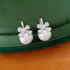Aretes de oro real de 14k con baño de circonita, moño y perla, aretes simples y versátiles para el día a día, lujo ligero y sensación de alta gama