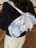 Bolsa de Ombro Feminina Nova Moda Outono 2026 Orelhas de Coelho para Axila Bolsa de Grande Capacidade Estilo Universitário Versátil