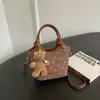 Bolso cruzado para el día a día Bolso tipo cubo casual Bolso de hombro estampado retro a la moda Bolso de mano con textura personalidad elegante