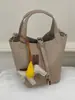 Bolso de mujer 2026 nuevo modelo, bolso de mano casual para el día a día, bolso de hombro y bandolera versátil y a la moda, bolso tipo cubo de nicho texturizado