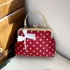 Pañuelo de seda 2026 nuevo elegante lunares cadena moda versátil simple bandolera de un hombro bolso con clip boca concha