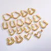 Brincos da Moda 2025 Coração Torcido Formato de Pêssego Aço Inoxidável Banhado a Ouro Real Brincos de Pressão de Óleo Joia de Orelha Personalizada de Nicho