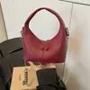 Bolsa de Dumpling Portátil de Nicho Transfronteiriça para Mulheres 2025 Nova Versátil Bolsa de Axila Simples e Estilosa Bolsa Transversal com Alça de Corrente