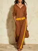 Conjunto feminino de duas peças transfronteiriço europeu e americano 2026 com acabamento amarelo contrastante, gola semiaberta, top com zíper e calça pantalona de cintura alta com caimento fluido