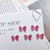 Accesorios populares para arte de uñas con lazo de estampado de leopardo estilo chica popular, tachuelas de uñas con lazo tridimensional versátiles, dulces y geniales, y decoraciones de resina