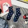 Calcetines de lunares dulces nuevos de otoño e invierno calcetines de lunares para niños estilo académico caricatura japonesa y coreana fabricantes de Liaoyuan al por mayor