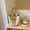 Bolso grande de lona estilo casual simple Shuai Mi Jia para mujer, nuevo bolso de hombro tipo tote de gran capacidad de moda 2026, para ir al trabajo