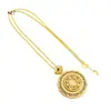 Colgante de brújula de ocho tesoros con filigrana azul verdosa, collar de cobre hueco giratorio chapado en oro de estilo antiguo con diseño retro étnico