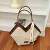 Bolsa de mano retro de gran capacidad transfronteriza para mujer, nuevo estilo 2026, bolso de hombro de alta calidad, elegante y versátil para el trabajo, y se puede llevar bajo el brazo