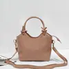 Nuevo bolso tipo cubo de cuero, con una textura suave de cuero PU, versátil bolso cruzado o de hombro, con un asa de cuerda de algodón anudada, un bolso de mano único y elegante para mujer