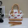 Bolso de Mano Clásico Popular de Comercio Exterior Cuero Genuino Bolso de Mujer Bolso Cruzado de Hombro de Alta Calidad Bolso tipo Concha para Mujer Marca Grande Productos de Guangzhou