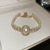 Pulsera Coreana Japonesa de Circonita Cúbica Perla Redonda Pulsera de Lujo Ligero Sensación de Alta Gama para Mujer Versátil para el Trabajo Temperamento Elegante Joyería para Manos Venta al por Mayor