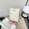 Bolso cruzado de hombro tejido de alta gama para mujer, transfronterizo, nuevo para otoño 2026, versátil, mini bolsa compacta y ligera para teléfono