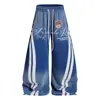Pantalones de pierna ancha con estampado de letras a rayas tie-dye para hombre, diseño moderno hip-hop, corte holgado, estilo de nicho
