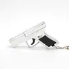 Mini Pistola de Juguete Multifuncional Tres en Uno Láser Rojo Infrarrojo Silbato Llavero Luz Cob Linterna Pequeña