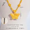Loja de ouro Puzuo com borboleta dançante incrustada de ouro de areia pingente de colar de borboleta nova corrente de clavícula de borboleta chinesa feminina