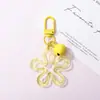 Llavero con hebilla de flor hueca transparente fresca y colorida, accesorio de campana, colgante para bolso, venta al por mayor