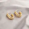 Pendientes Ovalados Geométricos de Acero de Titanio Transfronterizos Europeos y Americanos para Mujer Aro Dorado de Moda Sencillo Nicho de Lujo Ligero Pendientes de Temperamento de Gama Alta