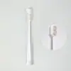 Venta directa de fábrica cepillo de dientes japonés de diez mil pelos protección dental empaque de cilindro de pelo de fibra suave ultrafina un cepillo multiusos al por mayor