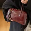 Bolso de hombro para mujer 2026 gran capacidad moderno coreano modelo nuevo de invierno con acabado brillante y diseño simple