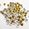 Venta al por mayor del fabricante Diamantes Blancos Guomao Grado A Punta Redonda Espalda Plana Vidrio Diamantes Blancos Alta Calidad de Color y Luz Pedrería Premium Tamaño 2-20