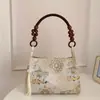 Bolso casual versátil de estilo nacional chino nuevo transfronterizo, bolso de mano retro estilo vacacional de bambú, bolso de hombro y axila para mujer