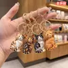 Llaveros lindos de gato estilo europeo y americano, dijes para bolso de mujer otoño/invierno, artículos populares transfronterizos, colgantes de esmalte y pedrería de alta gama, suministro al por mayor