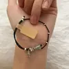 Pulsera Trenzada Simple de Estilo Chino Nuevo con Pez Pequeño y Mariposa Diseño de Nicho Estilo Literario de Alta Gama Joyería de Mano Versátil