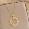 Collar de acero y titanio de estilo japonés-coreano para mujer, cadena de clavícula de alta gama, sin color, ligero, de lujo, con trébol de cuatro hojas a juego.