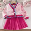 Exportación Transfronteriza Otoño Nuevo Ropa para Niñas y Niños, Conjuntos Energéticos de Tops Rosas de Manga Larga y Faldas Plisadas