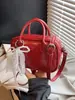 Bolsa de Bowling Feminina 2026 Estilo Novo de Primavera Simples e Fashionável Bolsa de Ombro de Nicho Popular de Alta Qualidade Bolsa Transversal