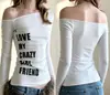 Camiseta de manga larga INS transfronteriza estilo americano para primavera y otoño, dulce y picante, con estampado de letras, hombros descubiertos Y2K, top versátil para la calle para mujer