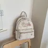 Mochila pequena floral de cor clara Milk huhu atmosfera suave menina doce saída de compras diária mochila pequena