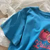 Recomendado por Blogger: Camiseta de Manga Corta para Mujer con Estética Americana Estilo Vintage, Textura Desgastada, Coordinación de Colores, Cuello Redondo, Amigable con la Piel