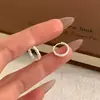 Aretes de plata con diseño de textura de lava estilo coreano, 2026, elegantes y versátiles, de nicho y lujosos, adecuados para orejas recién perforadas, aretes para mujer