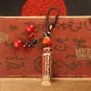 Llavero de tarro con mantra Lingyagn de aceite rojo, tarro hueco de latón puro con sutra, se puede abrir para guardar sutras, colgante de cuerda trenzada hecho a mano