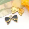 Amazon Acero Inoxidable Esmalte Dorado Goteo de Aceite Lujo Ligero Colgante DIY Corbata de Moño Colgante Accesorios de Joyería