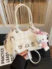 Bolso de mujer lindo de nicho súper popular 2026 nueva moda bolso cruzado versátil bolso de mano mini exquisito bolso tipo cubo